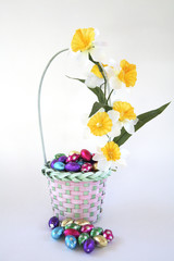 Easter egg basket decorated with flowers.