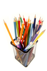 Fototapeta premium Pencils in wire basket on white
