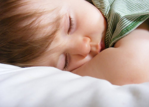 Tired Toddler Sleeping on Pillow