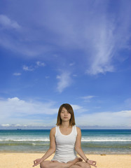 Fototapeta na wymiar Meditating on the beach
