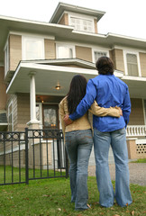 Young Couple Looking At House - 12784224