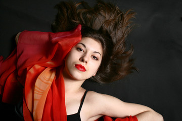 Portrait of the beautiful girl with developing hair.