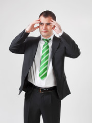 stressed businessman with his hands to his head