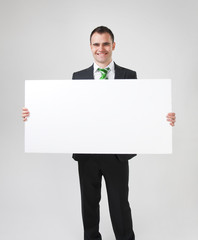 business man holding big white card