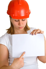 women in a red helmet shows on a sheet of paper