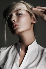 Young attractive blond female with creativity hairstyle - obrazy, fototapety, plakaty