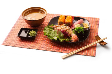 Asian business lunch with miso soup, sushi, maguro, salad