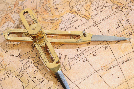 navigation device on a background an old map