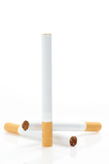Cigarettes over white,vertical composition
