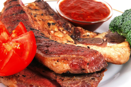 beef steak served with vegetables