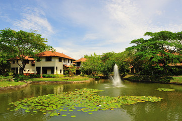 chalet at the side of a pond