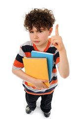 Young boy holding books, looking up isolated on white