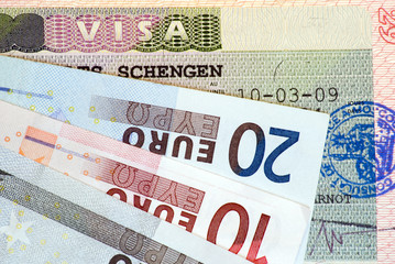Obraz premium Travel in Europe: Schengen Visa and euro banknotes
