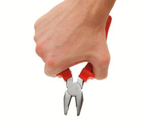 Red combination pliers held in hand; isolated on white