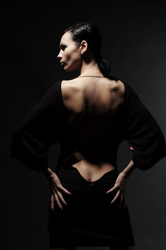 glamor woman in dress with naked back