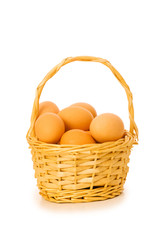 Basket full of eggs isolated on white