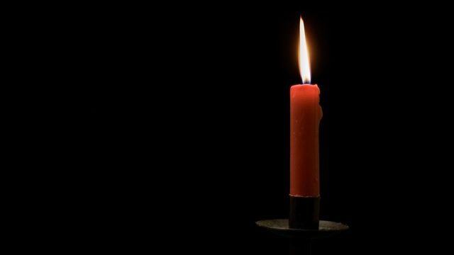 Burning red candle