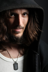 Portrait of handsome guy with dogtag