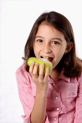 Young Girl Eating Green Pear