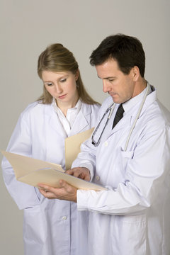 Doctors consulting over patient file