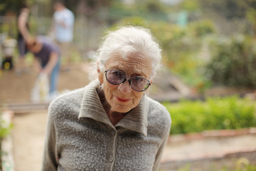 Portrait of a senior woman outdoors, looking in camera