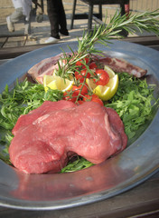 Fresh meat prepared for cooking in a barbeque