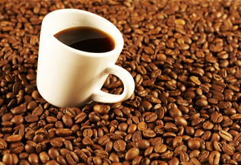 white cup of coffee in the background