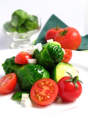 Fresh organic salad of Brussel sprouts and cherry tomatoes