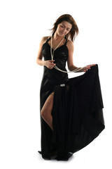 Girl in black dress isolated on white background