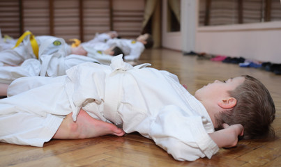 karate boy in sport hall makes exercise © Pavel Losevsky