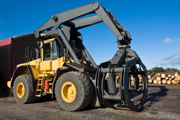 Big yellow grapple loader