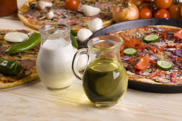 Sauce ane Three Pizzas With Components