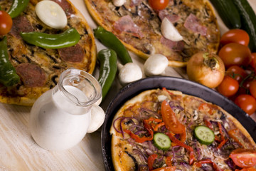 Three Pizzas With Sauce And Components