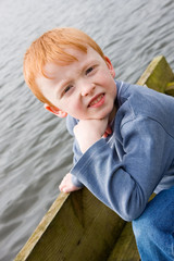 boy on the edge of a jetty