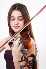 Portrait of the girl playing on a violin