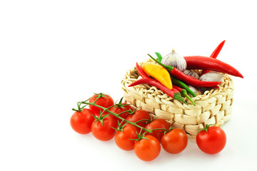 tomatoes, pepper and garlic in a basket