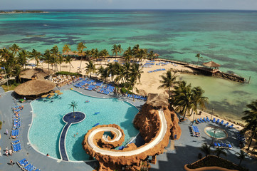 Resort with swimming pool by caribbean ocean