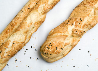 Two baguets laying on a table