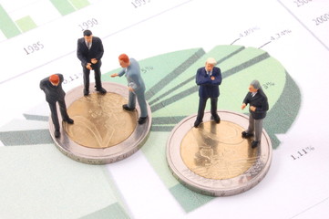 businessman and money over a chart