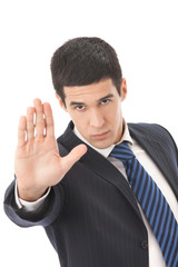 Unfriendly serious businessman or security man gesturing