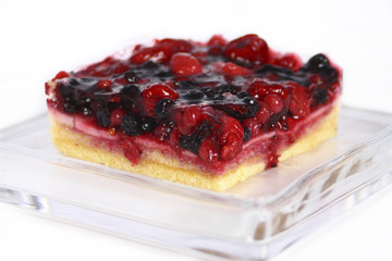fruit cake in glass plate on white background