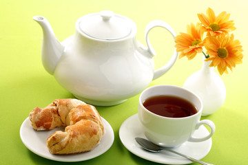 Breakfast concept with coffee and croissant