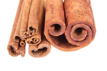 .Cinnamon sticks close-up over white