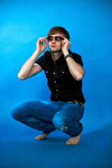 man sitting on his hunkers free pose looking up