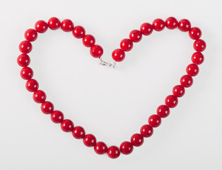 Heart from red mardi gras beads
