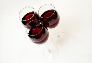 three glasses of red wine