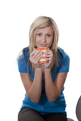 woman drinking from a mug