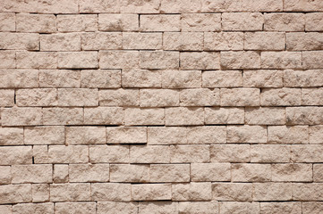 Fragment of rough gravel brick wall