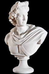 Classical marble white Apollo Bust isolated on black background