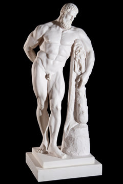 Classical white marble Hercules statue isolated on black